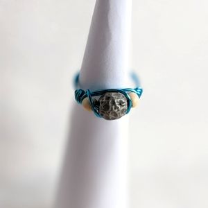 Blue ring with grey textured bead